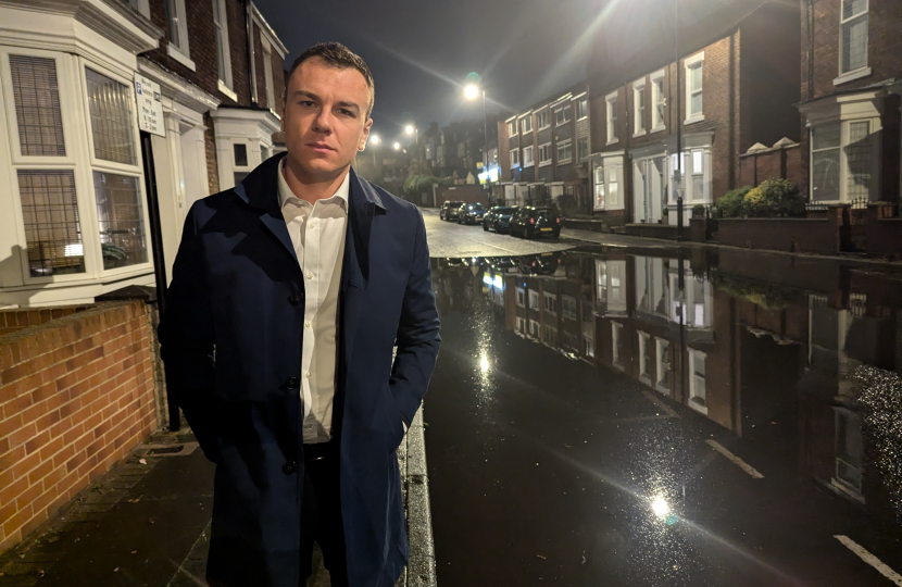 Cllr Lyall Reed on a flooded street in Ashbrooke 