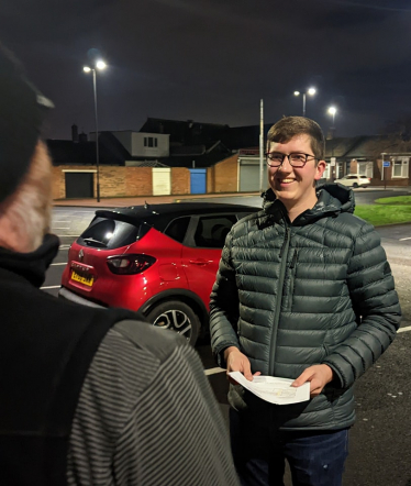 Josh talking to resident 